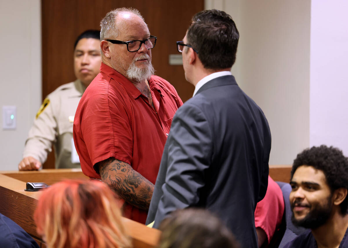 Richard Devries, 66, talks to his attorney Robert DeMarco during his initial court appearances ...