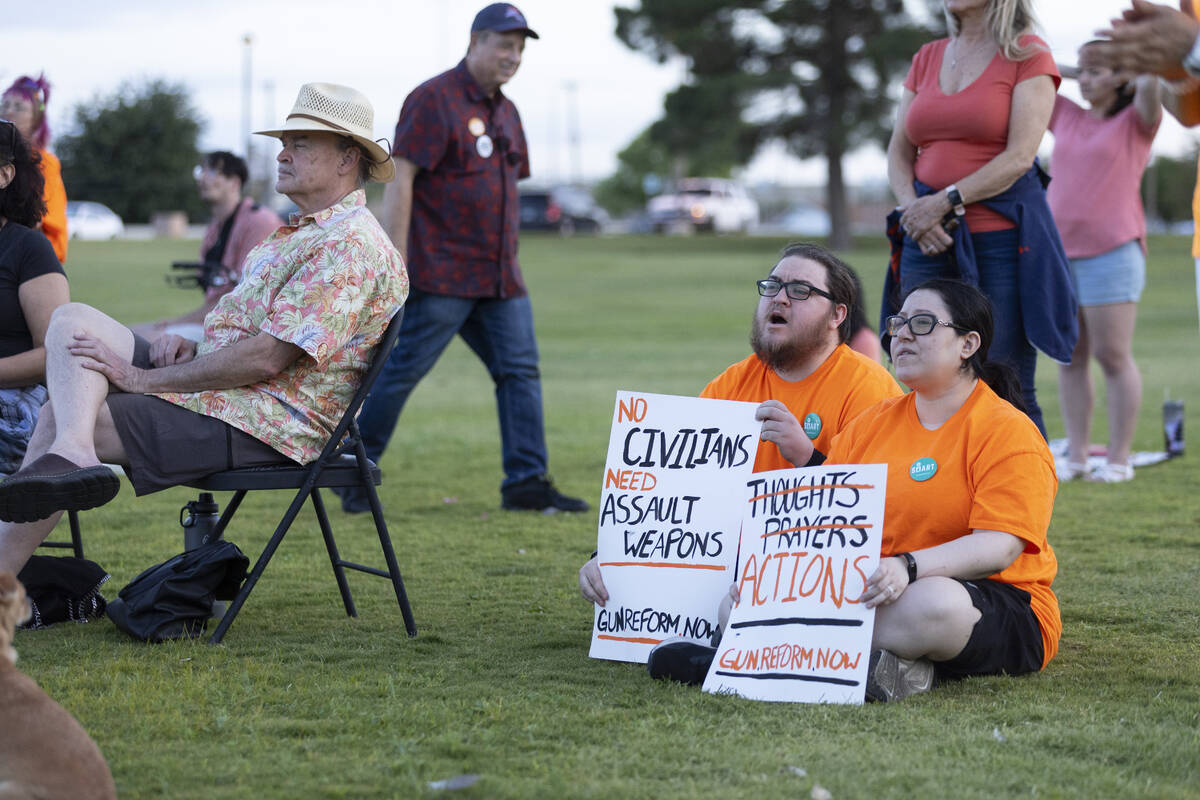 Nikolai Miles, left, and his fiancee Michelle Mendoza, attend the "Wear Orange" event ...