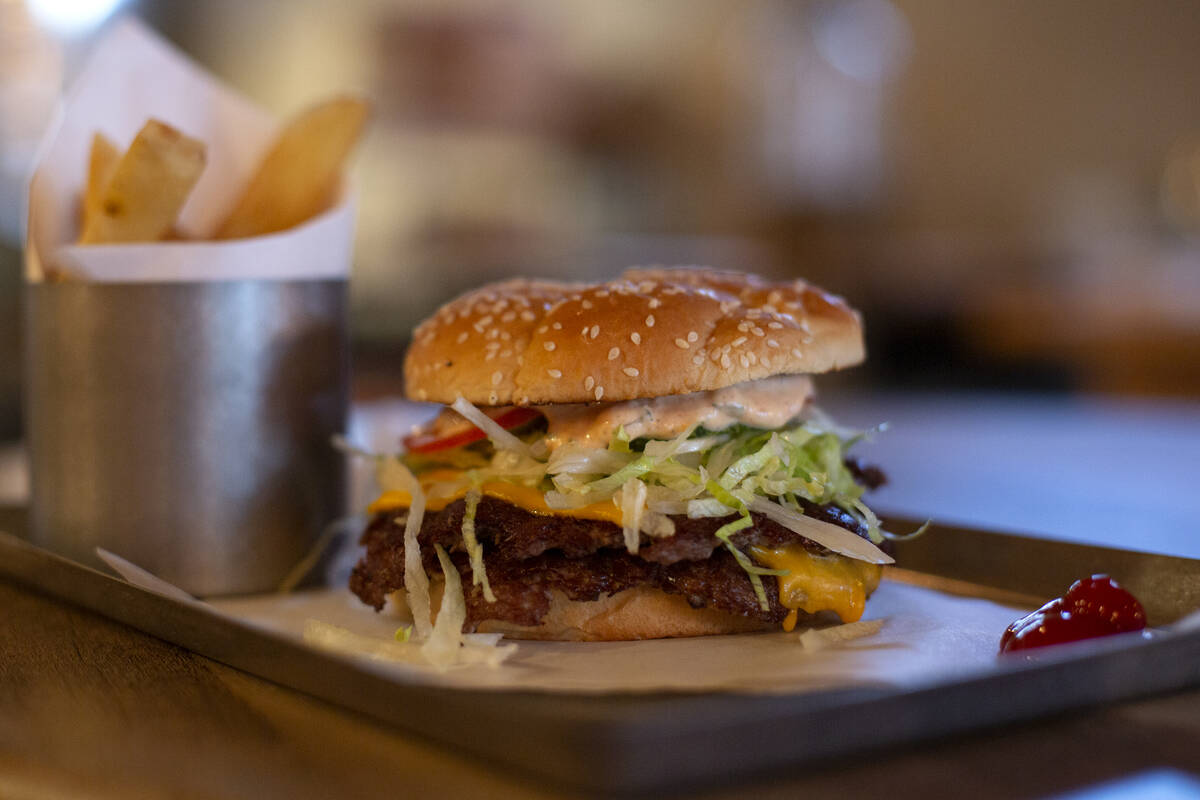 The “classic double” burger is on display for diners during Dinette’s judg ...