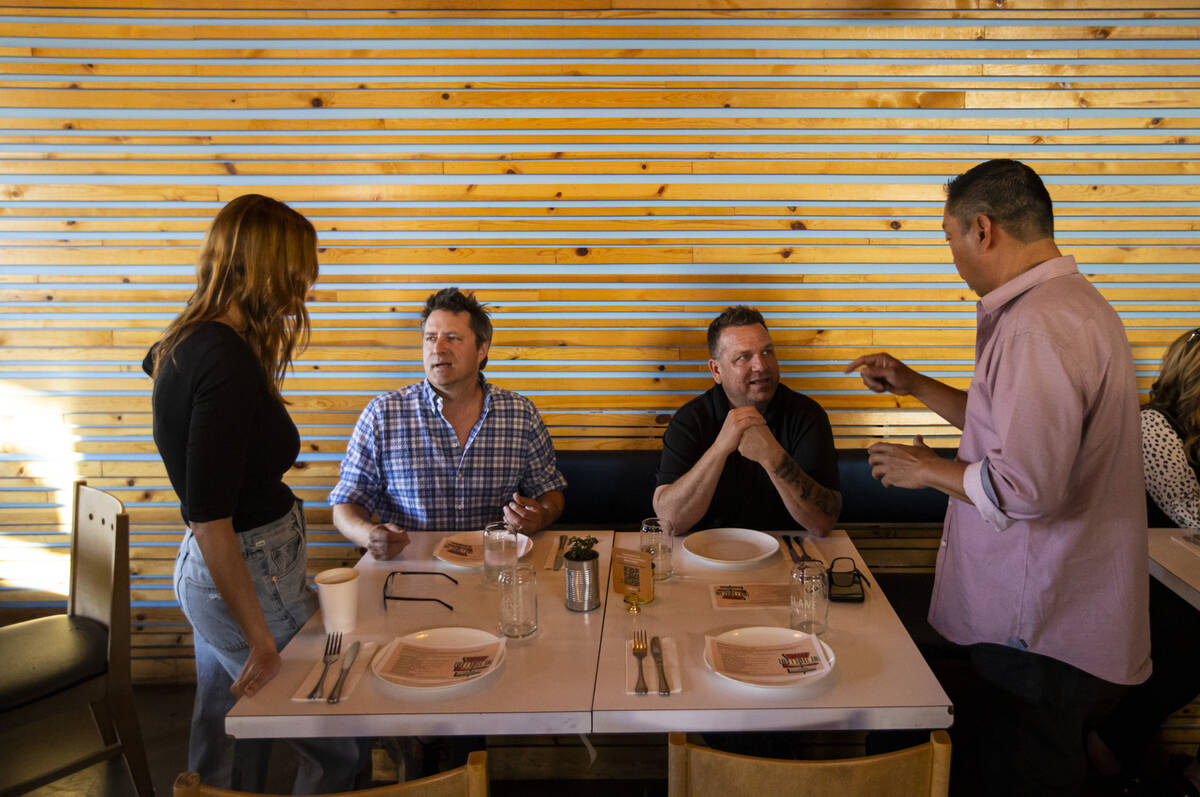 Jolene Mannina, founder of Vegas Test Kitchen, left, talks with John Simmons of Firefly, Tacos ...