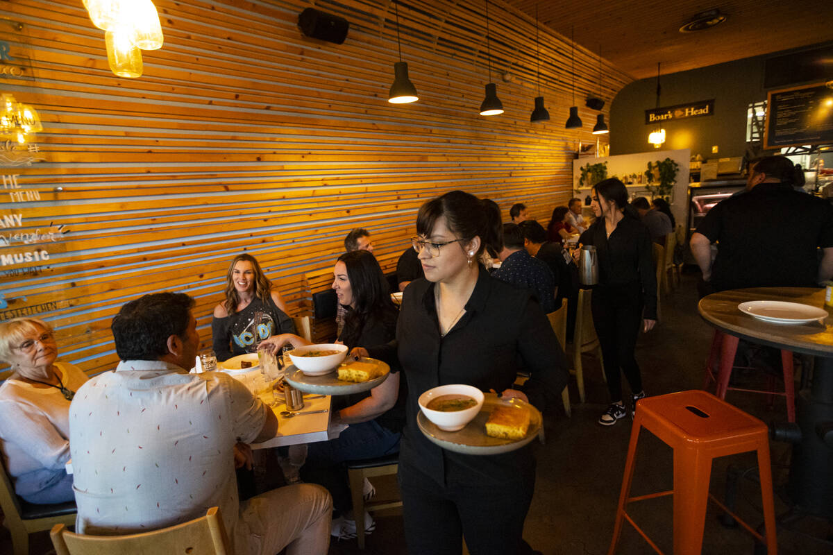 Waitress Blanca Prado carries Hamilton turkey chili and cornbread during a presentation by Rand ...