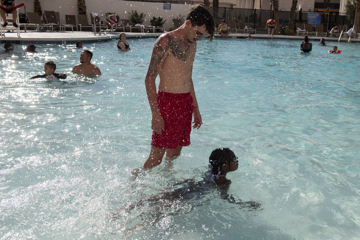 Chace Martinovics and Mari Zeno, 5, play in the newly-opened Circus Circus hotel-casino pool on ...