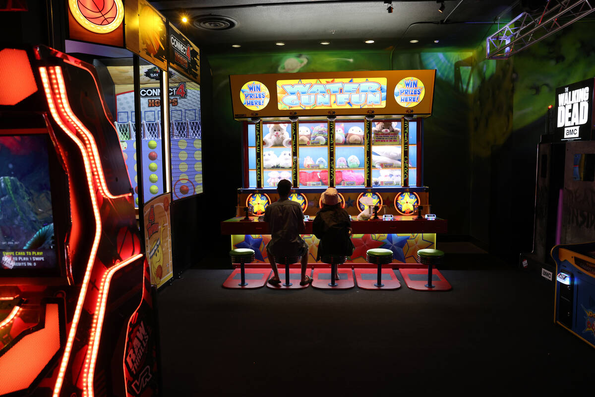 People play a game at a new midway at Circus Circus on the Strip in Las Vegas Friday, June 3, 2 ...