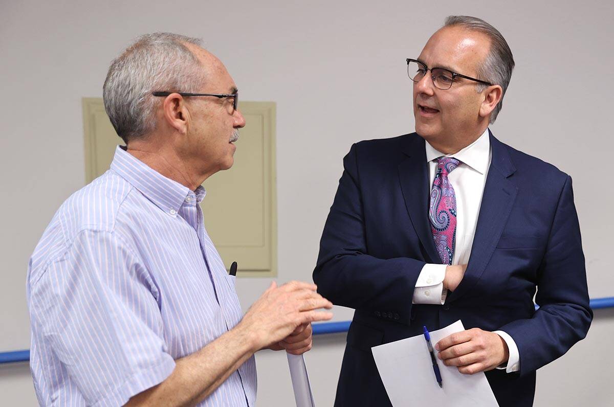 Clark County School District Superintendent Jesus Jara, right, speaks with John Vellardita, exe ...