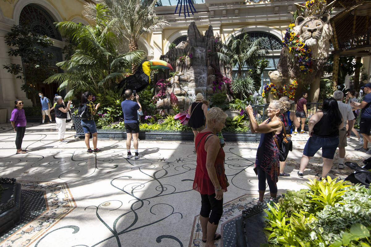 People visit the Bellagio’s Conservatory & Botanical Gardens in Las Vegas, Thursday, June 2, ...