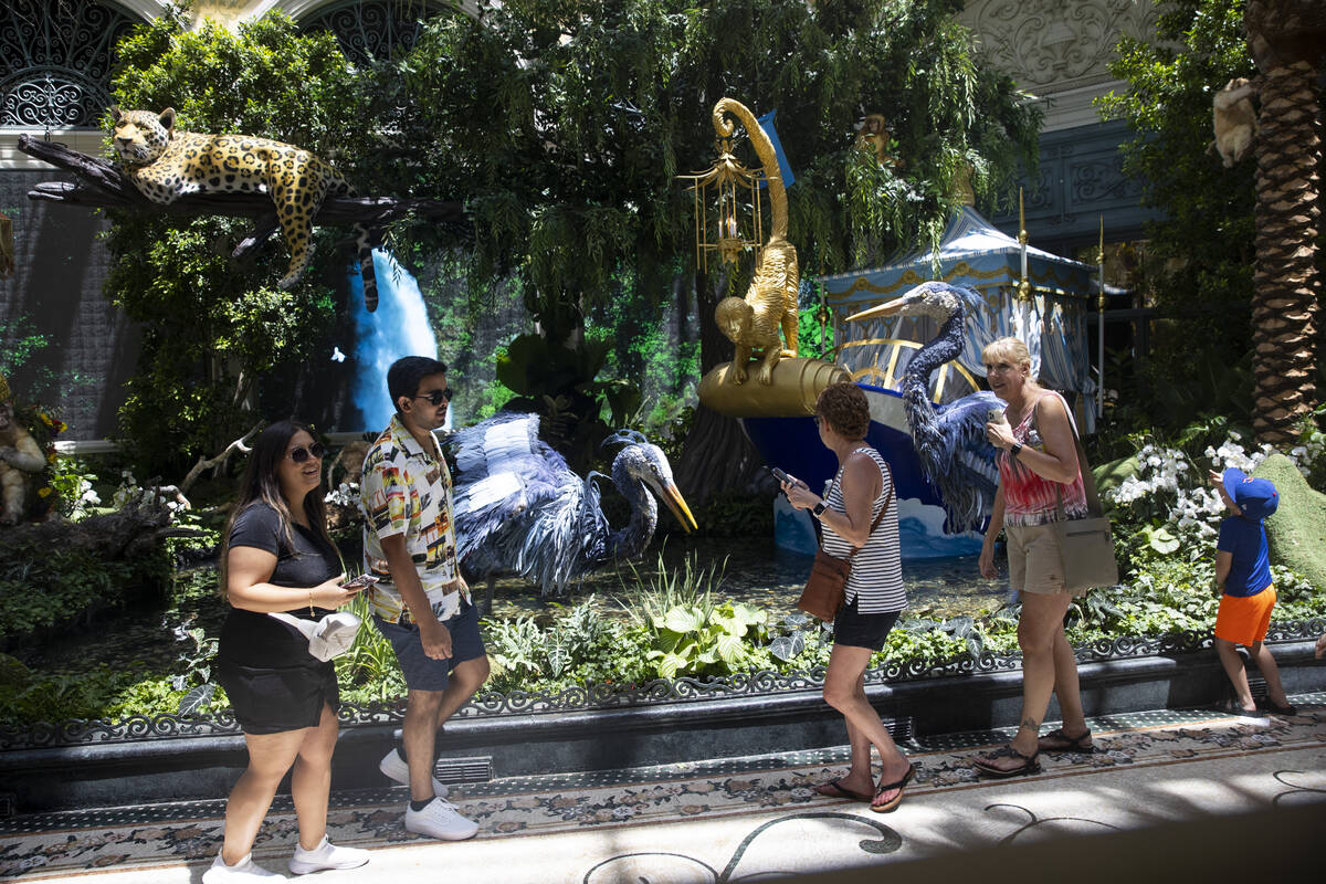 People visit the Bellagio’s Conservatory & Botanical Gardens in Las Vegas, Thursday, June 2, ...