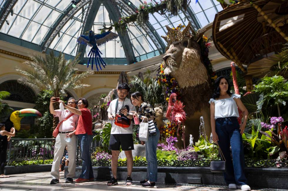 People visit the Bellagio’s Conservatory & Botanical Gardens in Las Vegas, Thursday, June 2, ...