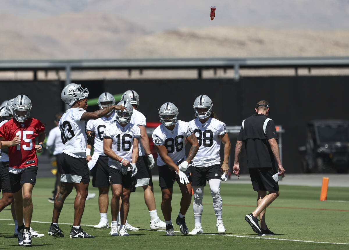 Raiders tight end Darren Waller (83) tosses a gatorade after hydrating during practice at Raide ...