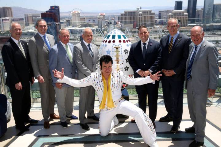 Elvis impersonator Harry Shahoian poses with, from left, Steve Hill, CEO of the LVCVA, Pac-12 C ...