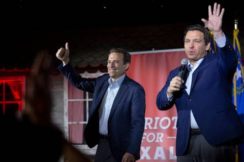 Nevada Republican U.S. Senate candidate Adam Laxalt and Florida Governor Ron DeSantis wave good ...