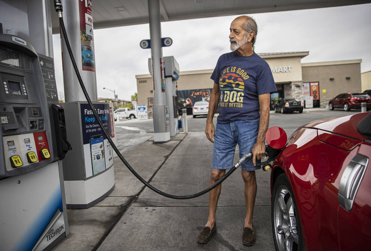 John Lasco pumps gas at Lucky Spot Chevron on Saturday, June 4, 2022, in Las Vegas. (Benjamin H ...