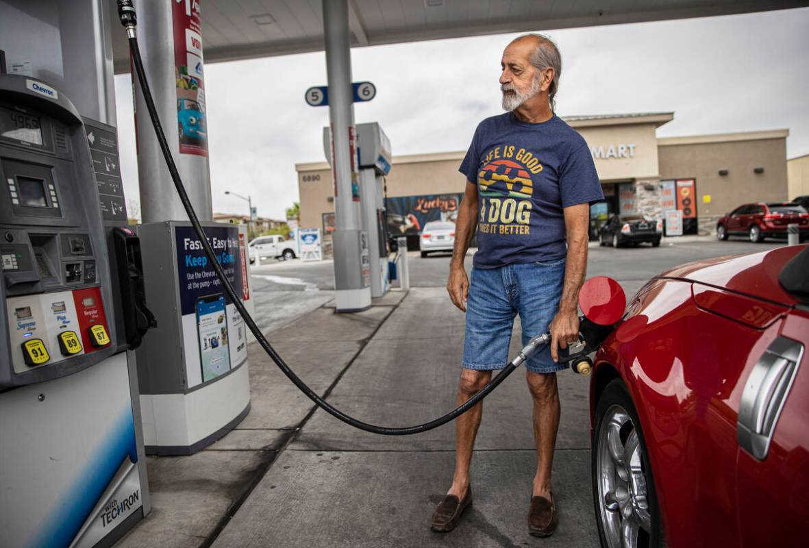 John Lasco pumps gas at Lucky Spot Chevron on Saturday, June 4, 2022, in Las Vegas. (Benjamin H ...
