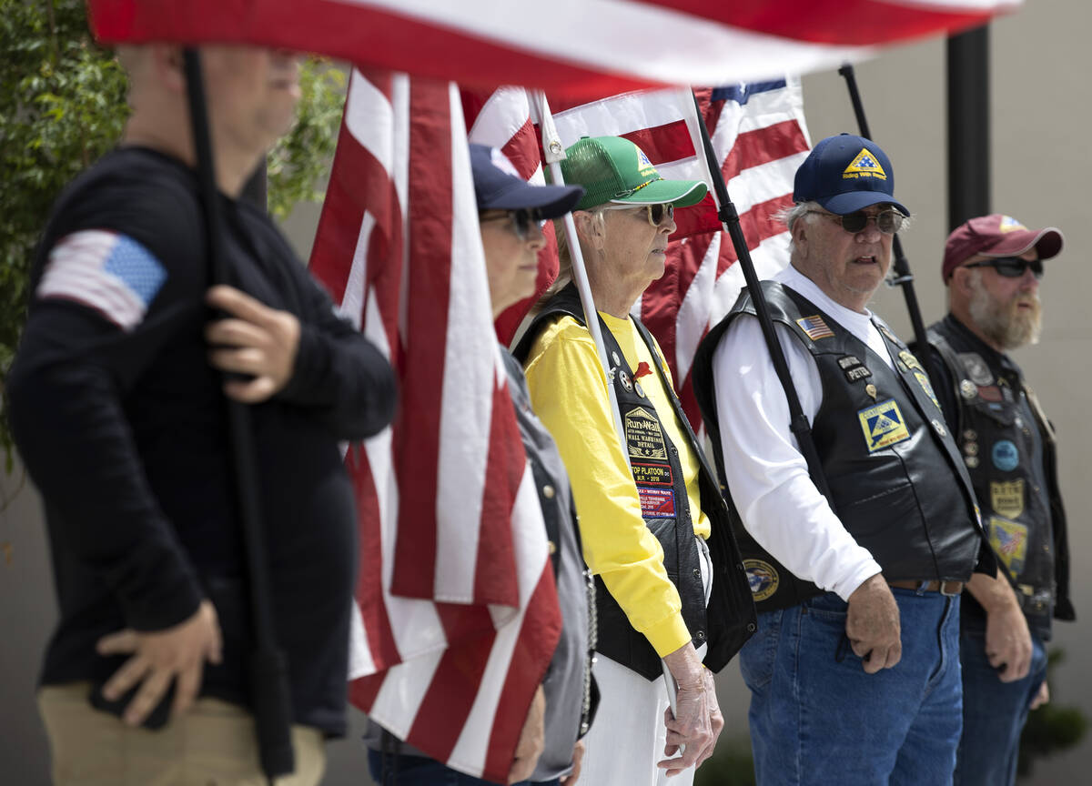 Veterans await the procession during a funeral for Officer Phil Closi, a Metropolitan police of ...