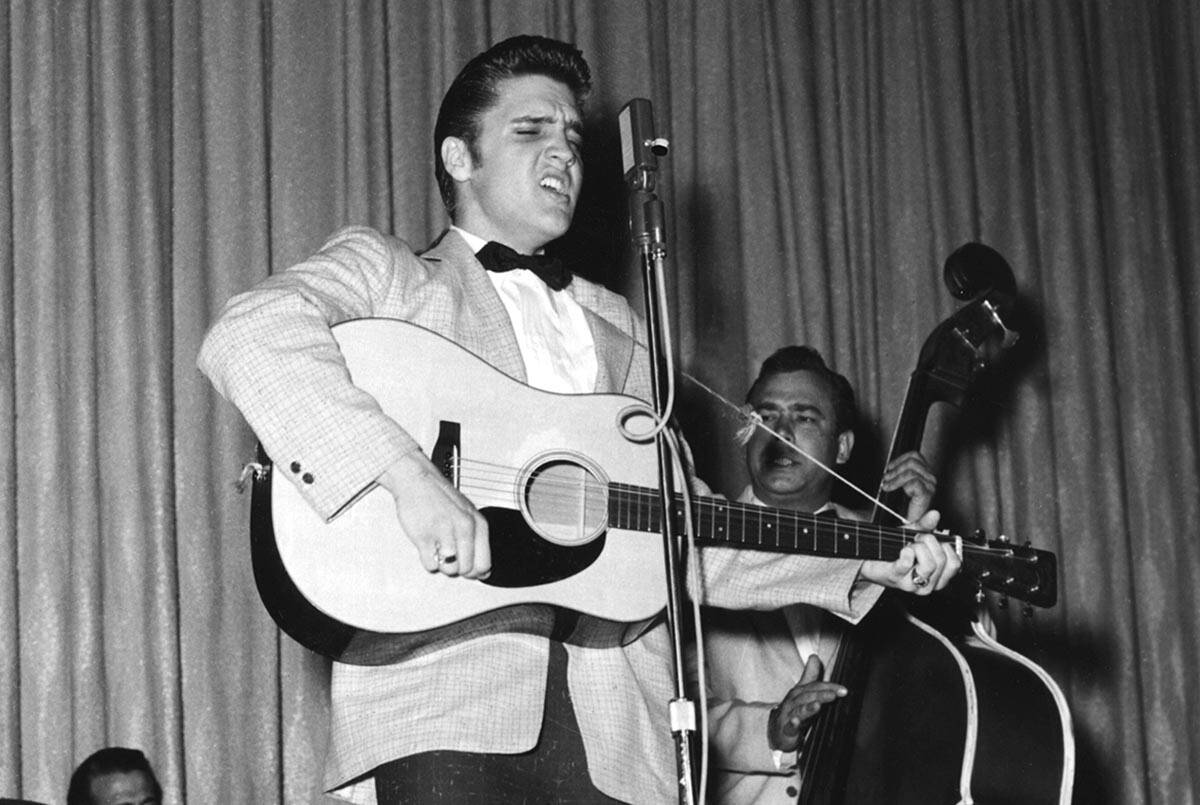 Elvis performs during his first run of shows at the New Frontier April 30, 1956, in Las Vegas. ...