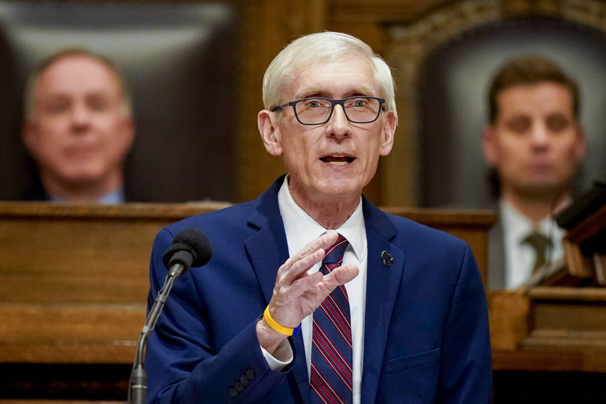 FILE - Wisconsin Gov. Tony Evers addresses a joint session of the Legislature in the Assembly c ...
