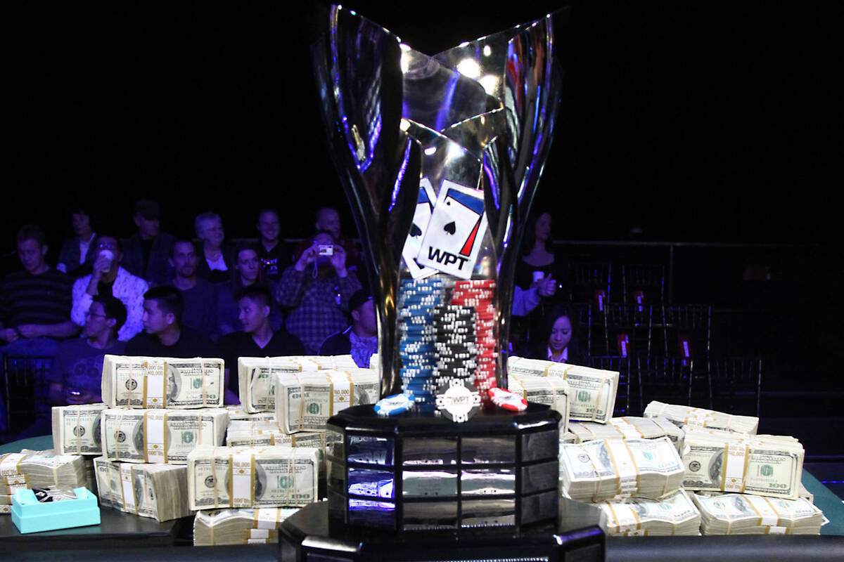 In this Dec. 11, 2011, file photo, Bundles of cash and the trophy for the 10th annual 2011 WPT ...