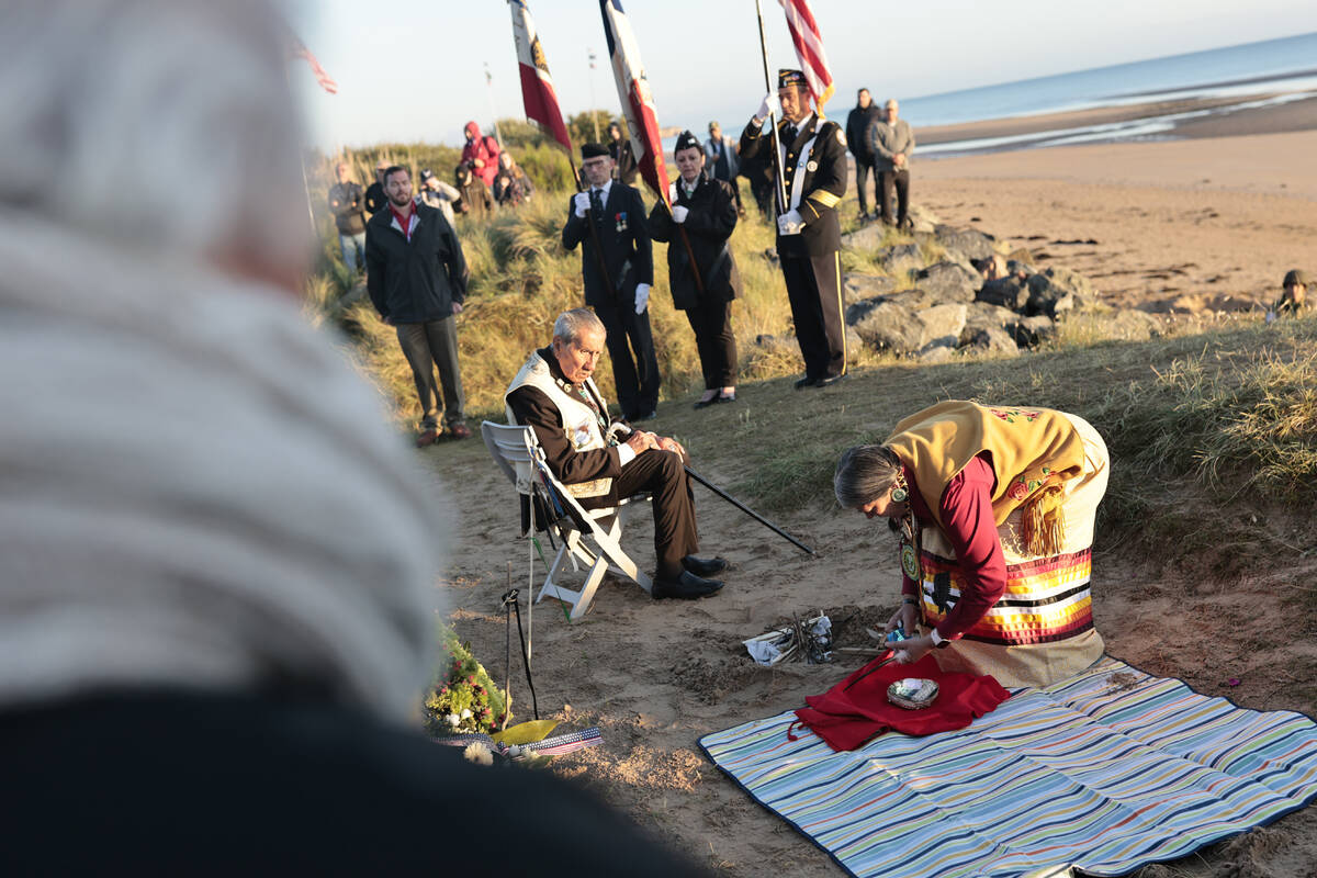 WWII veteran Charles Shay, 97, and Julia Kelly, a Gulf war veteran, pay tribute to soldiers dur ...