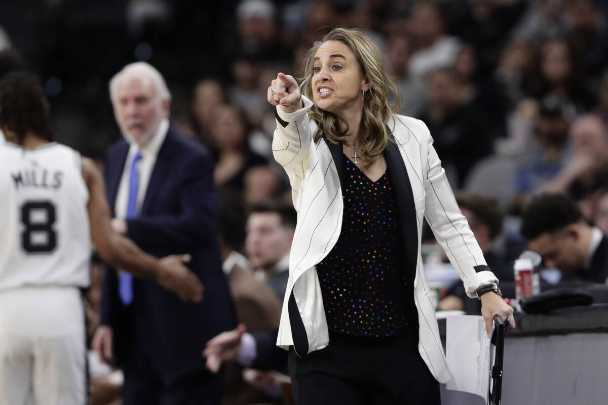 San Antonio Spurs assistant coach Becky Hammon signals to players during the first half of an N ...