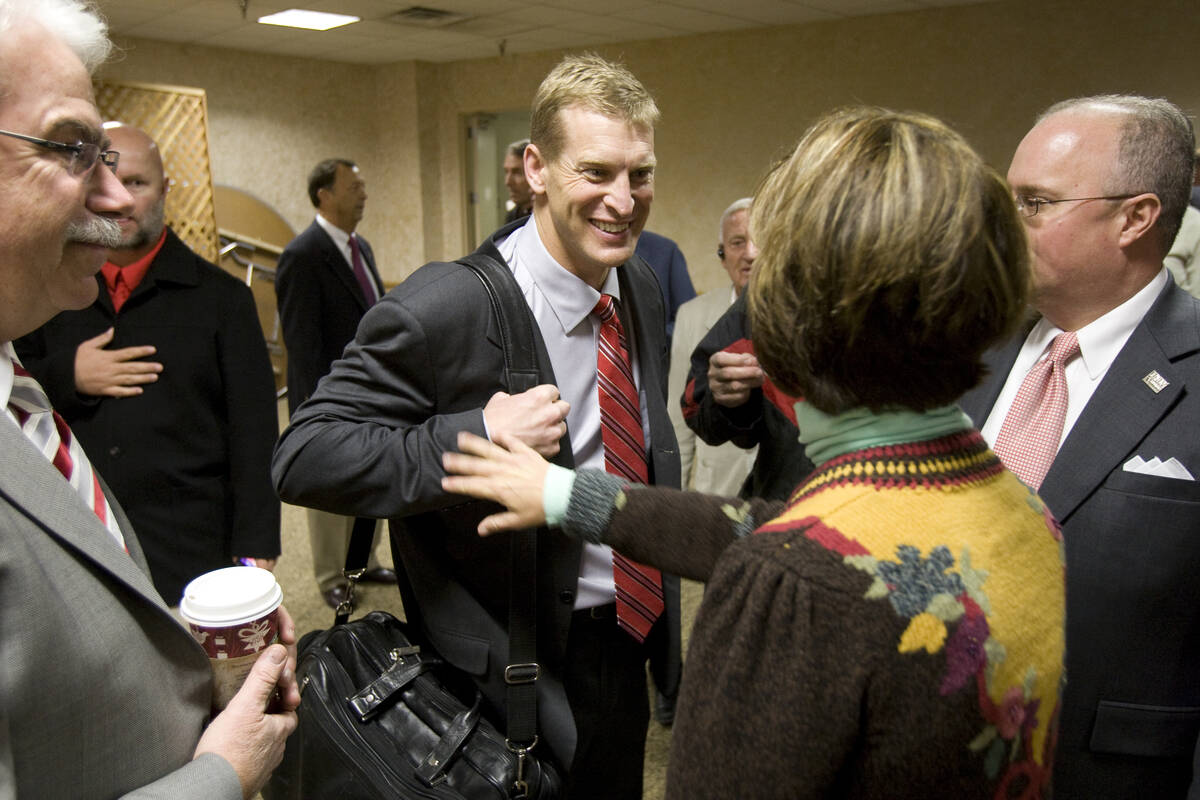 Former Montana football coach Bobby Hauck greets supporters before being introduced as UNLV's n ...