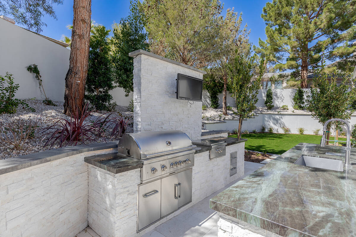 Ivan Sher Group The outdoor kitchen boasts of a 12-foot quartzite island with brand-new upgrade ...