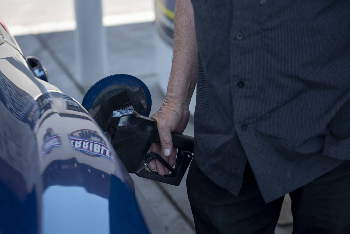 David Stubblefield, of Bakersfield, California, pumps gas at a Chevron station on East Fremont ...
