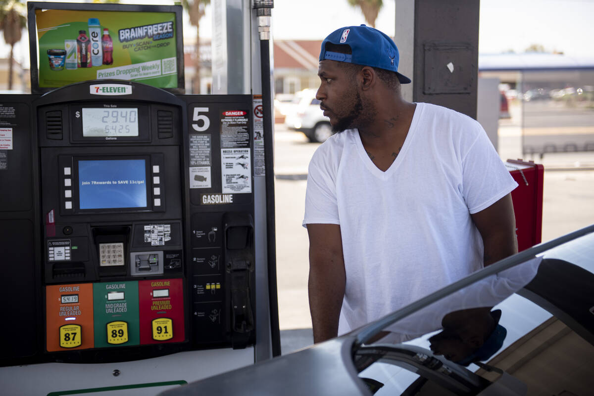 Jay Money pumps gas at a 7-Eleven station on East Lake Mead Blvd. on Monday, June 6, 2022, in N ...