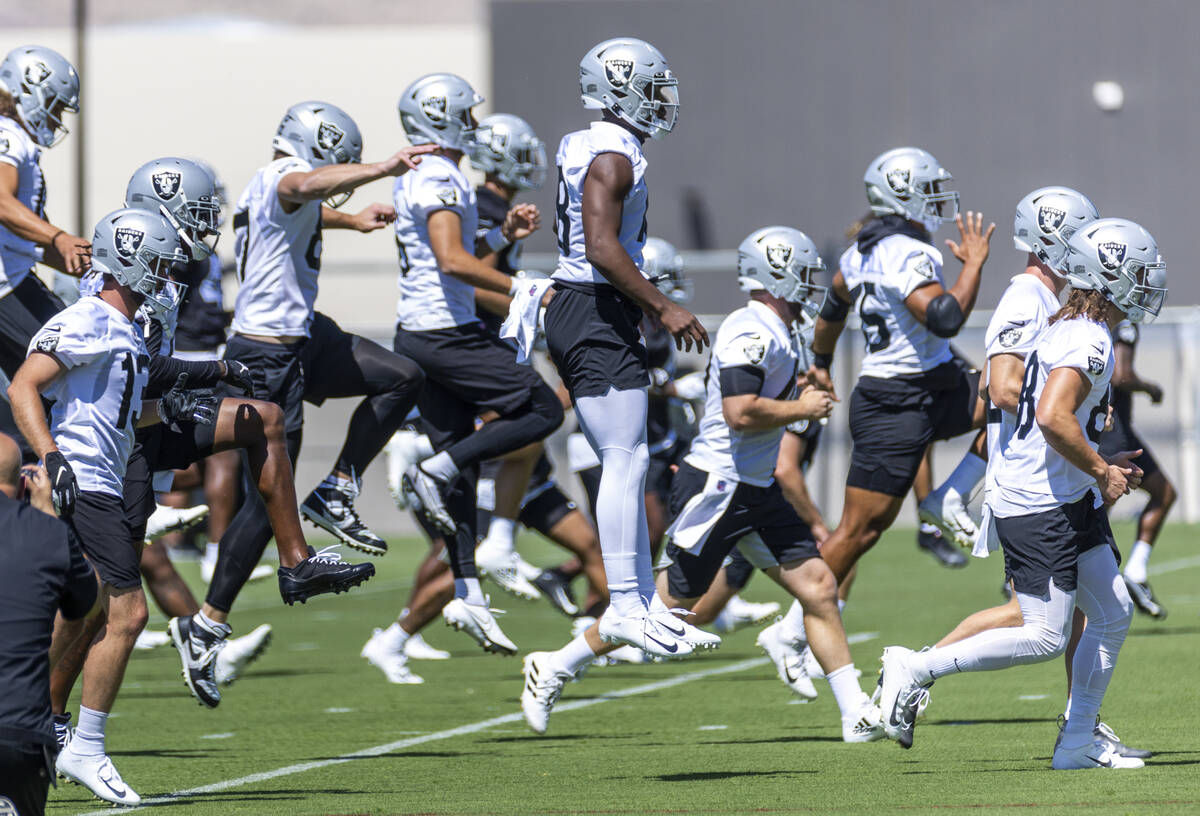 Raiders offensive players warm up during minicamp practice at the Raiders headquarters within t ...