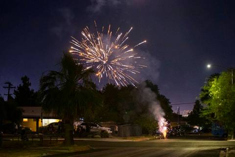 Illegal fireworks go off in a neighborhood near downtown Las Vegas in on Sunday, July 4, 2021. ...