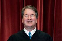 FILE - Associate Justice Brett Kavanaugh stands during a group photo at the Supreme Court in Wa ...