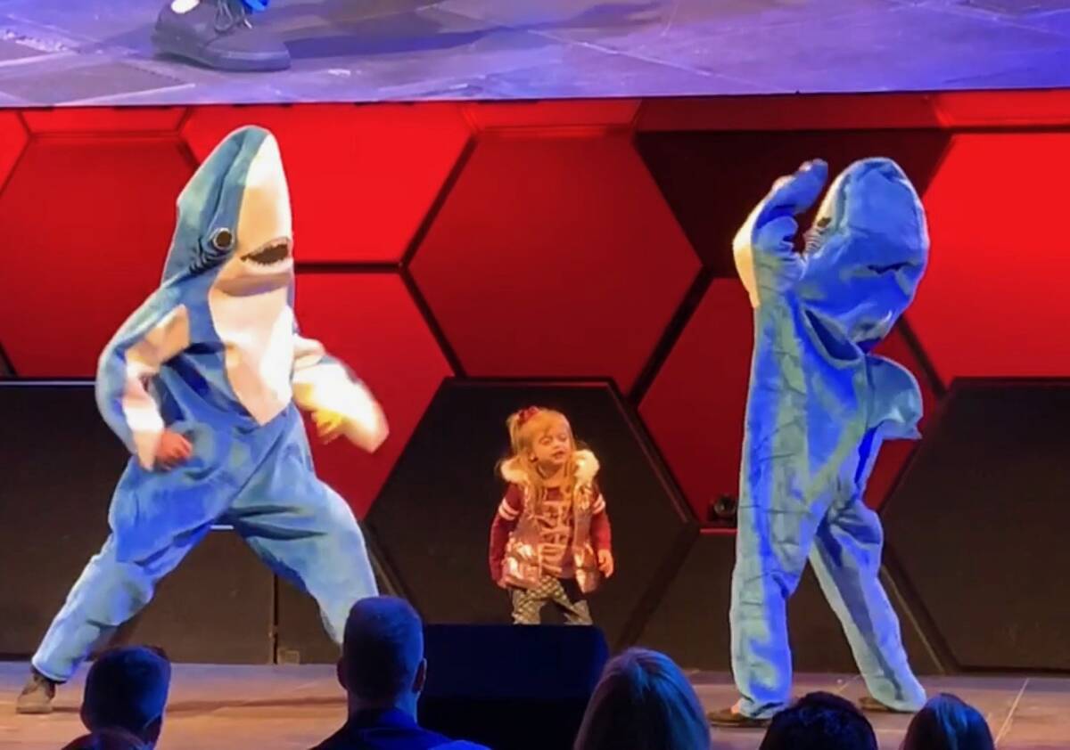 Angela Chan-Stopa and Wyatt Hopkins dance with a member of the Nevada Blind Children’s Founda ...