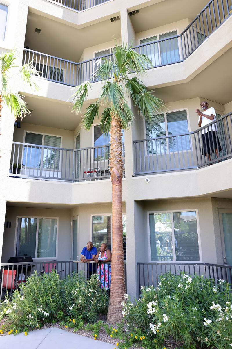 Residents Ronald and Andrea Powell, bottom and Gary Gilbert watch the grand opening of Arioso a ...