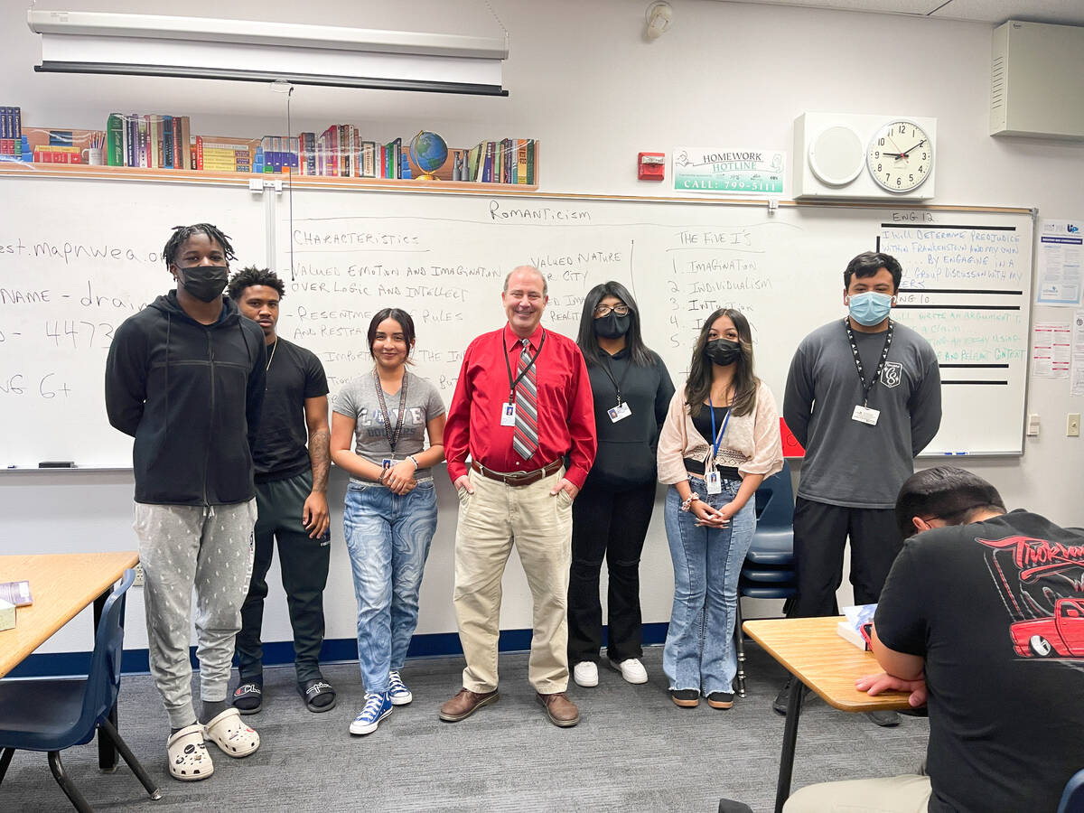 Canyon Springs High School English teacher Martin Vece, center in red shirt, with some of his s ...