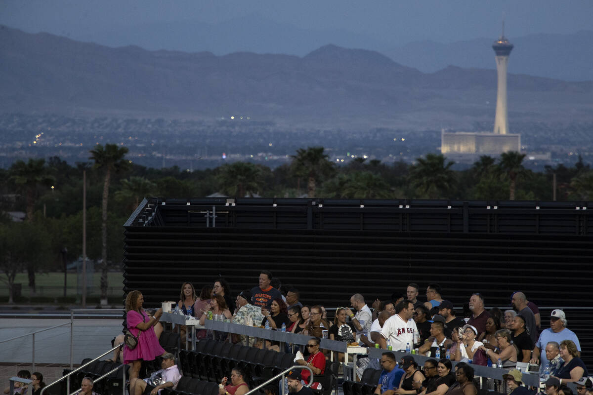 The STRAT is seen in the background while the party deck watches a minor league baseball game b ...