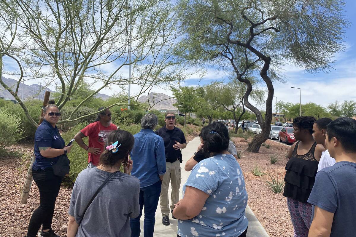 Police and onlookers congregate at Palo Verde High School on Thursday, June 9, 2022. (Glenn Pui ...