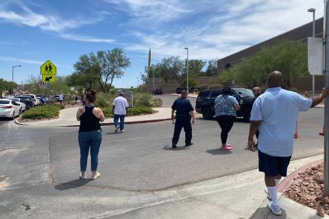 Police and onlookers congregate at Palo Verde High School on Thursday, June 9, 2022. (Glenn Pui ...