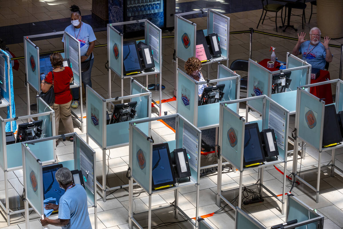 Area residents participate in the last day of early voting for the 2022 primaries at Meadows Ma ...