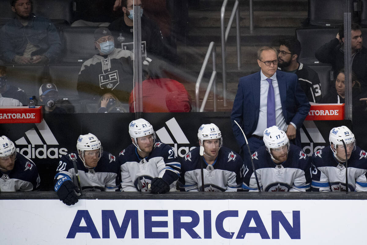 Winnipeg Jets head coach Paul Maurice watches his players during an NHL hockey game against the ...