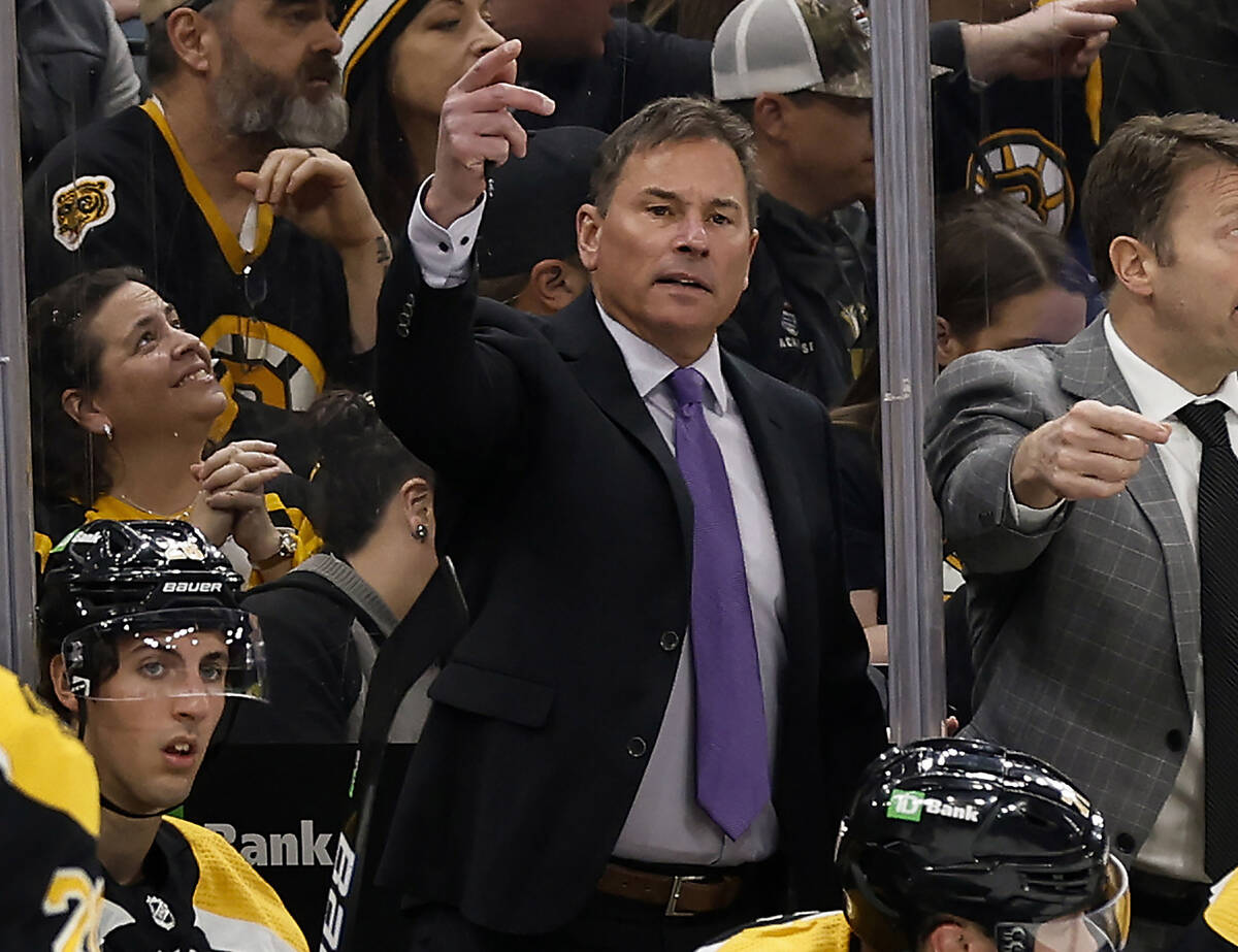 Boston Bruins head coach Bruce Cassidy, center, gestures during the third period of an NHL hock ...