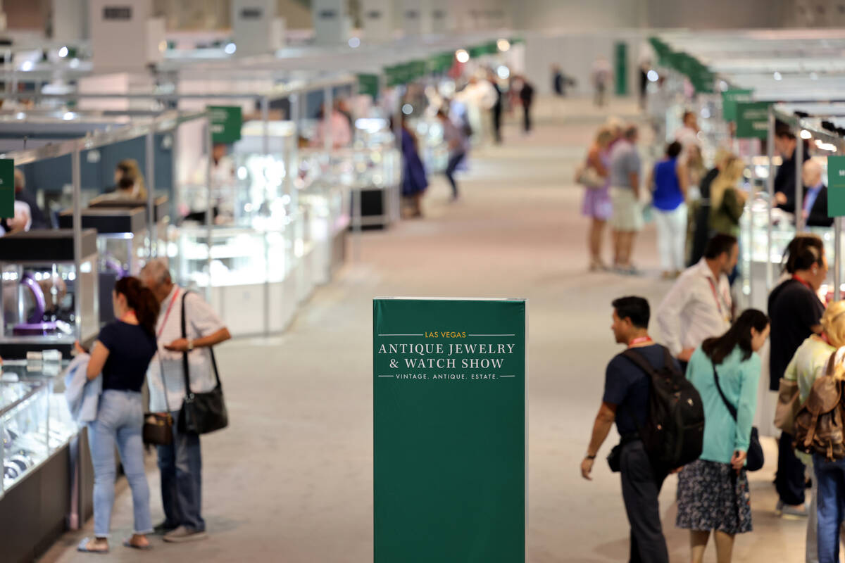 Conventioneers browse exhibitors during the Las Vegas Antique Jewelry and Watch Show at the Las ...