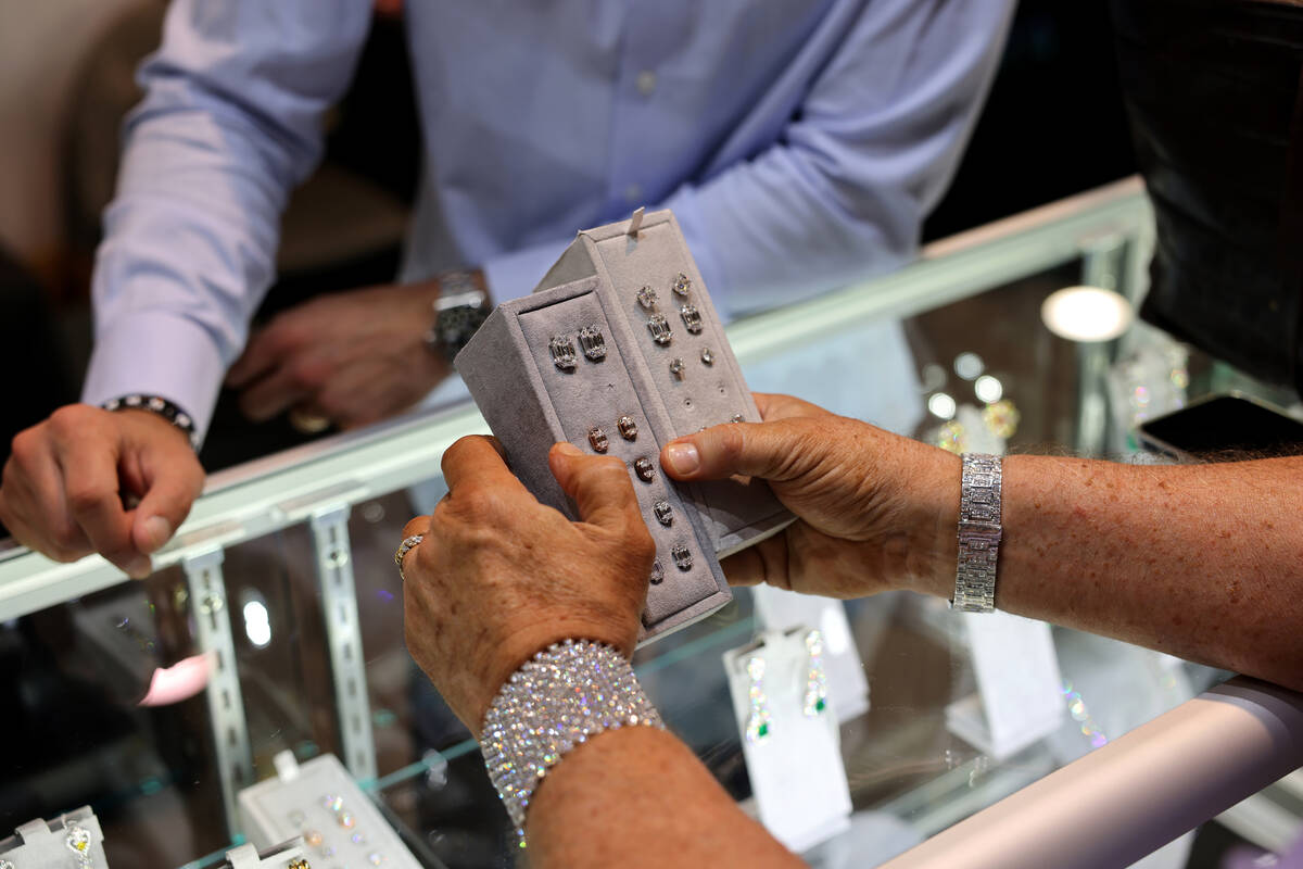 Joe “Diamond Joe” Pacetti of Dallas checks out jewelry at the Spectra Fine Jewel ...