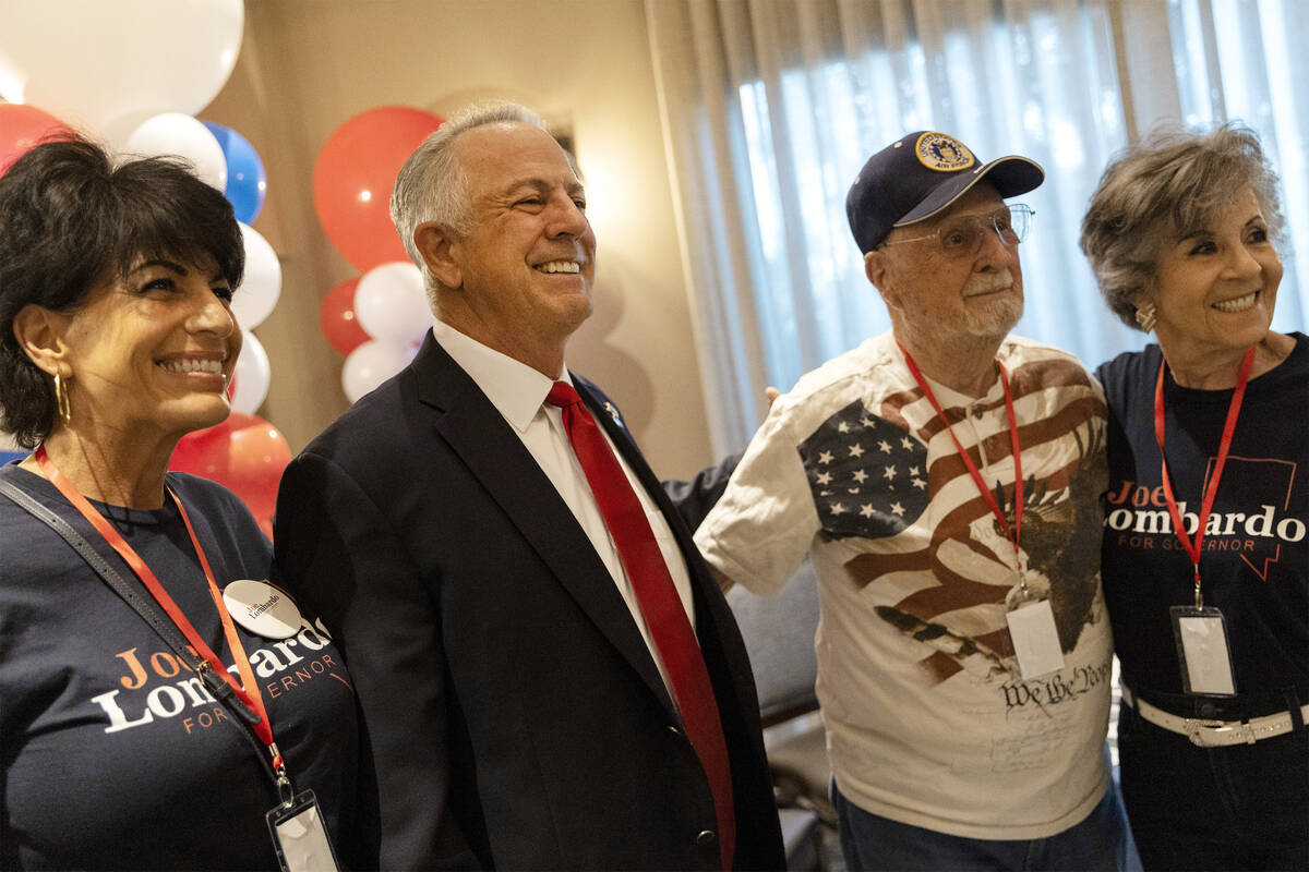 Republican candidate for Nevada governor Joe Lombardo, second from right, poses for photos with ...