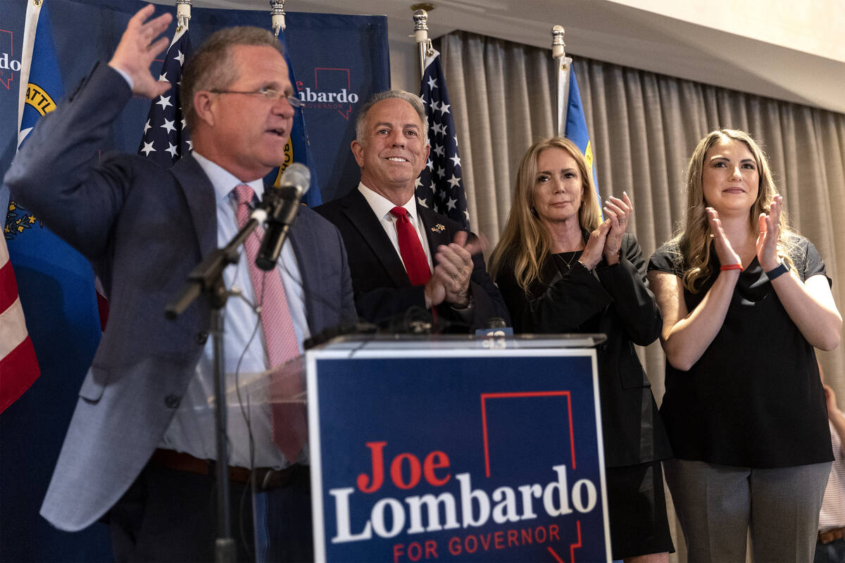 Former Lt. Gov. Mark Hutchison, left, announces a primary win for Republican candidate for Neva ...