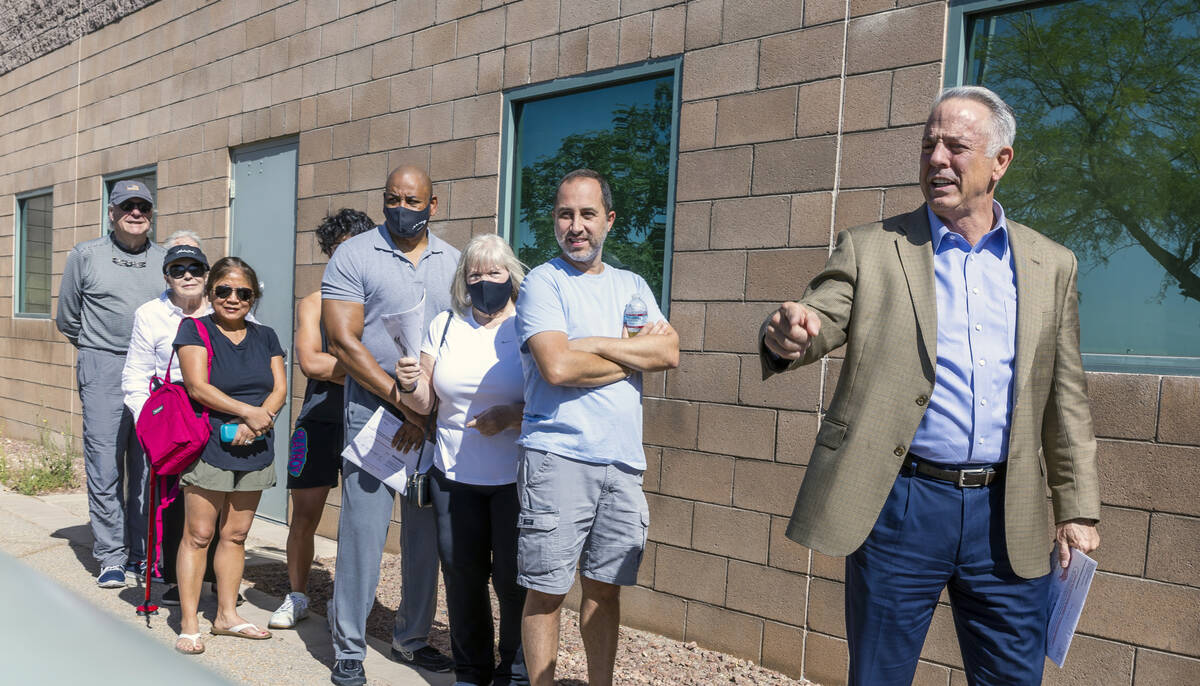 Sheriff Joe Lombardo chats with others while in line to cast his vote during the Nevada primary ...