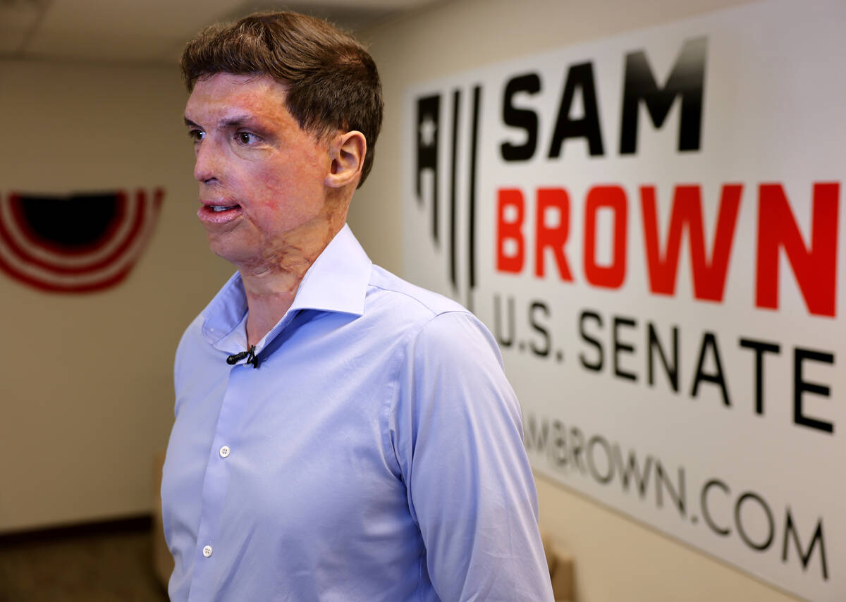 Army veteran and Republican U.S. Senate candidate Sam Brown talks to members of the news media ...