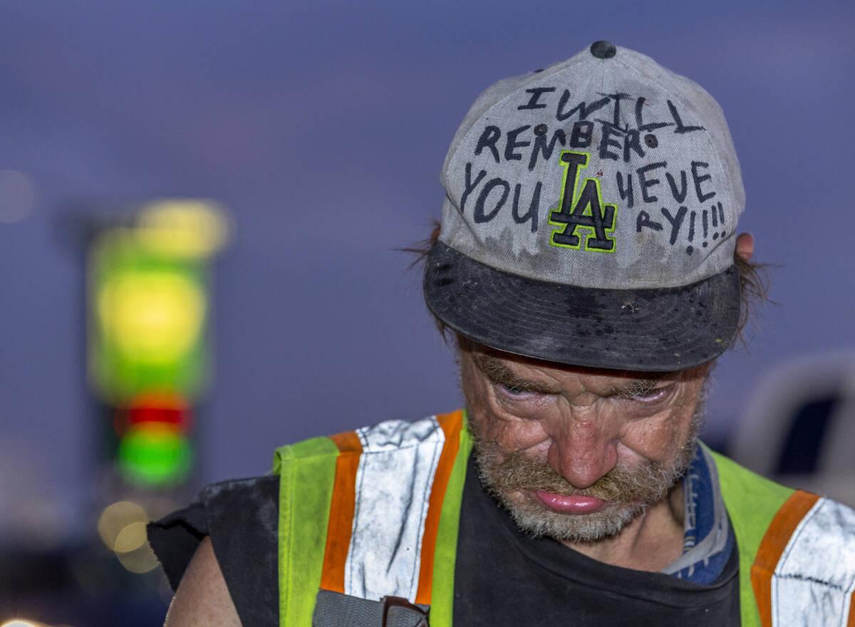 Popeye, a friend of beloved transient man, Kevin Wayne Williams, wears a hat and vest in his ho ...