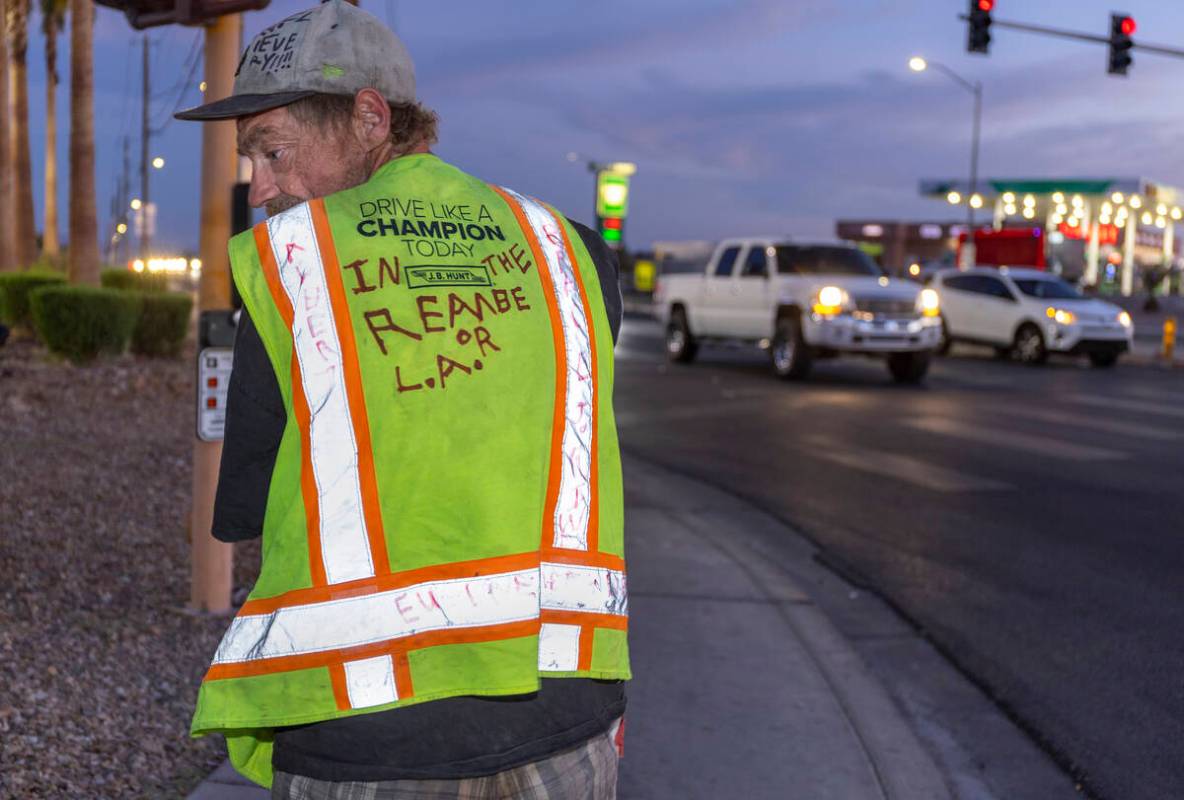 Popeye, a friend of beloved transient man, Kevin Wayne Williams, wears a vest in his honor at a ...