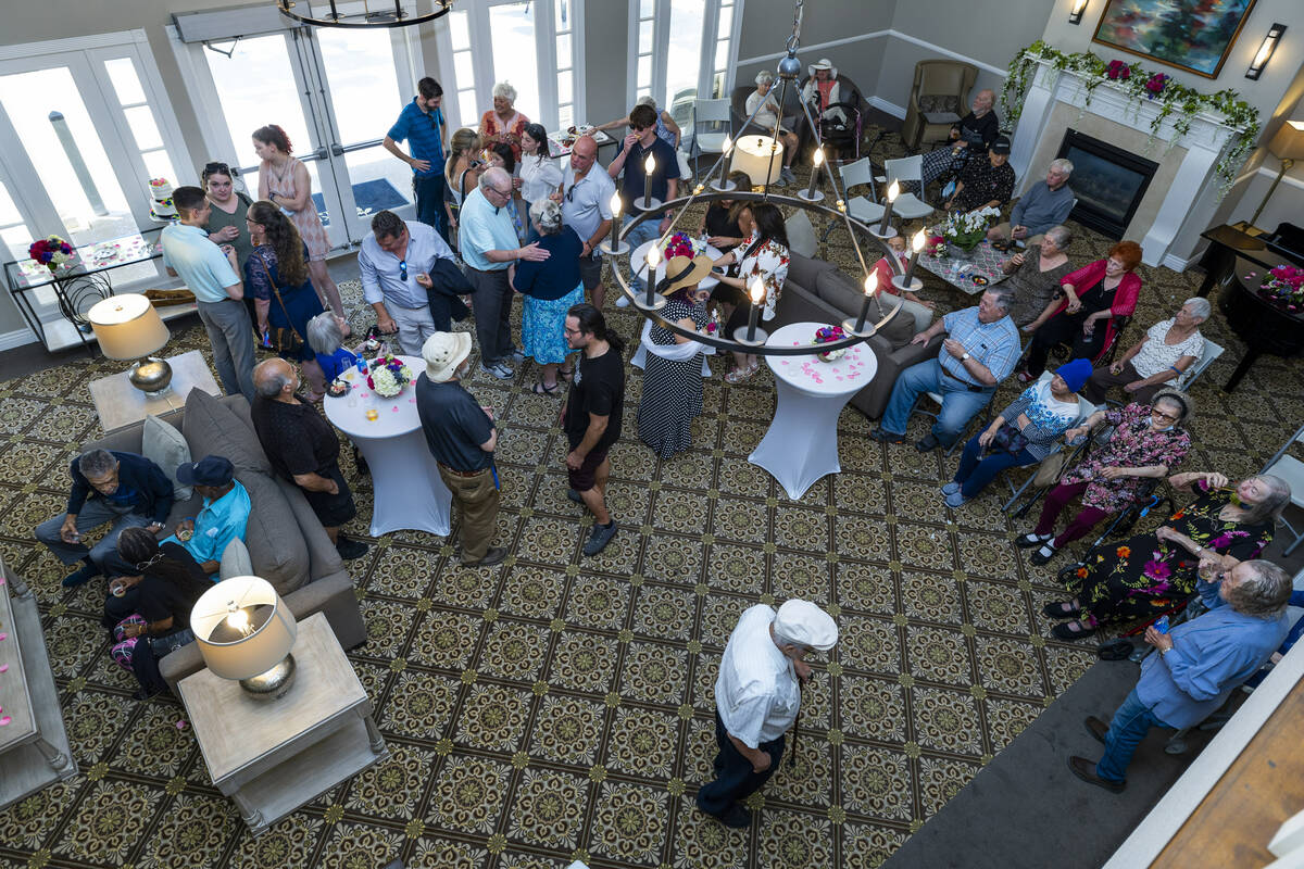 Bride Carolyn Brylinski and groom John Hansell enjoy reception with invited guests after being ...