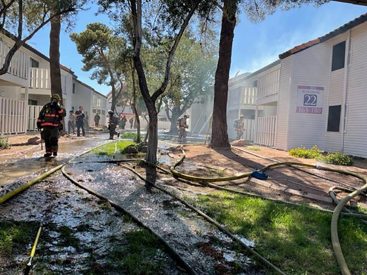 Firefighters hit hotspots after an apartment building fire at Lantana Apartments, 1200 S. Torre ...