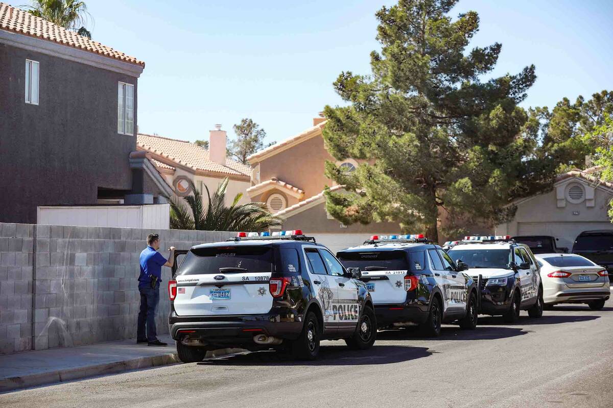 Police presence at the scene of a homicide at the 8200 block of Ogee Drive in Las Vegas, Sunday ...