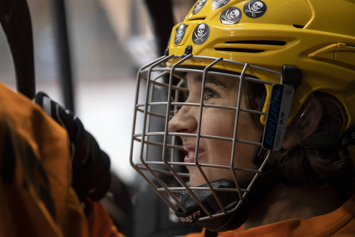 A member of the Miners smiles with teammates during a 14U Jr. Golden Knights Hockey League game ...